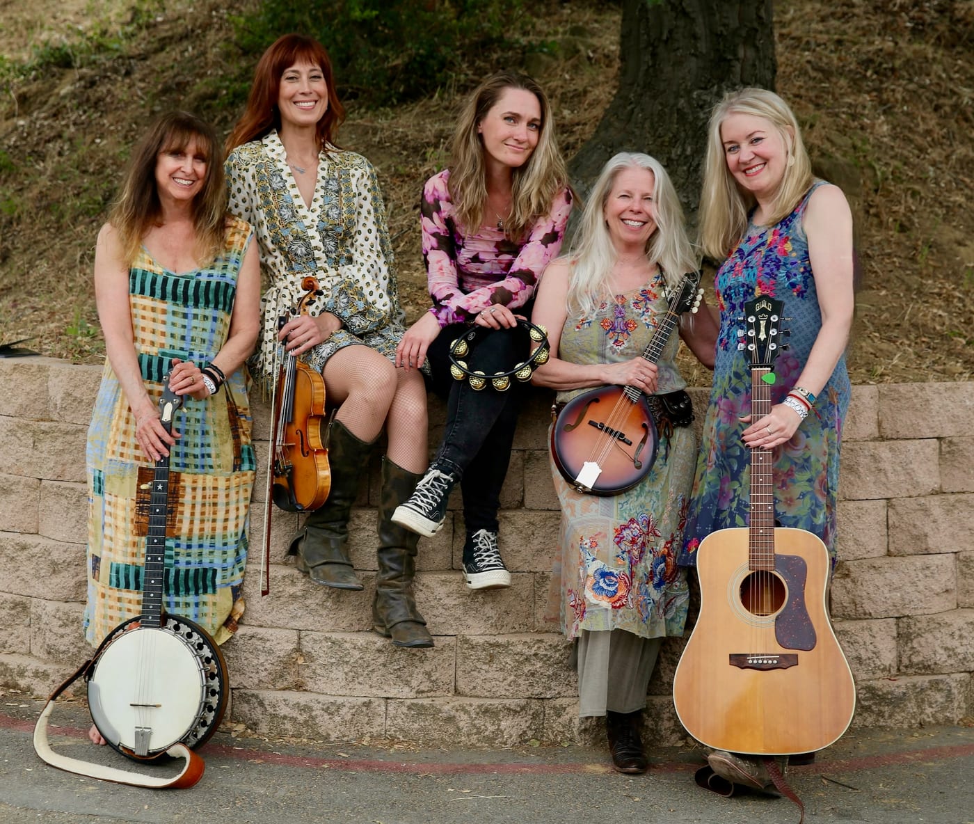 The five women of Sugar in the Gourd with banjo, fiddle, tambourine, mandolin and guitar